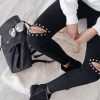 BLACK KNEE STUDS RIPPED JEANS